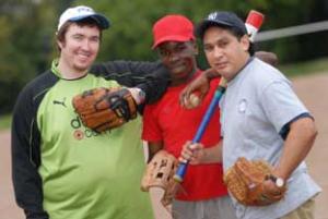 Big hit:(l-r) Ewan O'Connor, Timothy Ssali and coach Pedro Figueras from the Figueras Baseball Academy