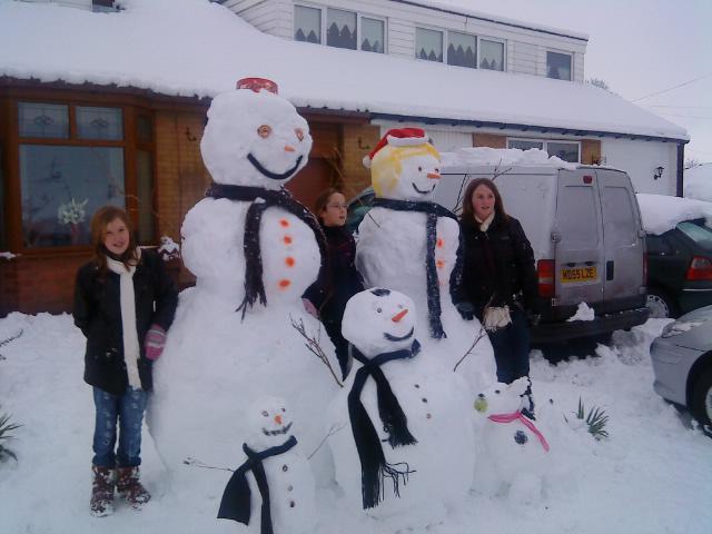 Family affair: snow people pose for pictures