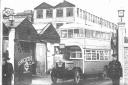 A bus leaving the factory in the 1920s