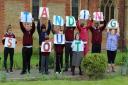Outstanding: Pield Heath youngsters celebrating their Ofsted report earlier this year
