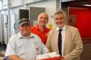 Eltham MP Clive Efford, pictured right, joins postie Matt Russell, left, and Royal Mail delivery manager Grant Smith