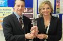 Award time: our picture shows Chief Executive Shane DeGaris presenting a previous award to Director of People Claire Gore