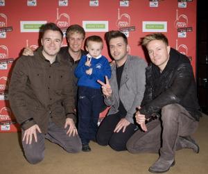Special visit: Macauley Rogers meets Westlife. Image: John Phillips
