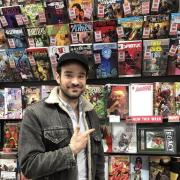 Charlie Cox (Daredevil) with comics at the convention