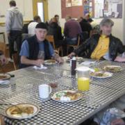 People at the Wimbledon Faith In Action drop in centre enjoying the free, hot lunch there