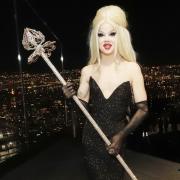 Willow Pill at the live crowning hosted by Peak restaurant NYC, photographed holding her crown and sceptre.