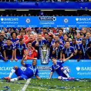 Chelsea players celebrate with the Premier League trophy at Stamford Bridge - it will be back to business in less than two months' time