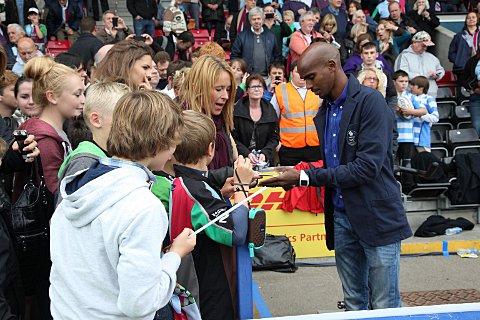 August: Teddington's Mo Farah was on top of the world after scooping a golden double at the Olympic Games. He celebrated by going to a Quins game