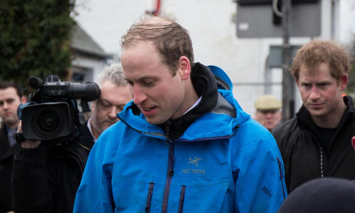 Royal blue: Prince William looks knackered after heaving sandbags from 6am!