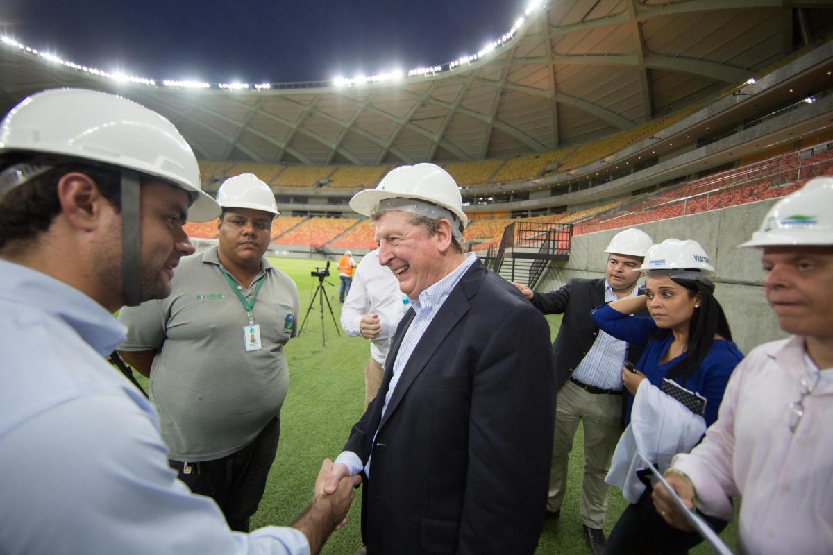 Roy meets stadium engineers during a visit to Arena Amazonia (Photo by Jonne Roriz/The FA via Getty Images)