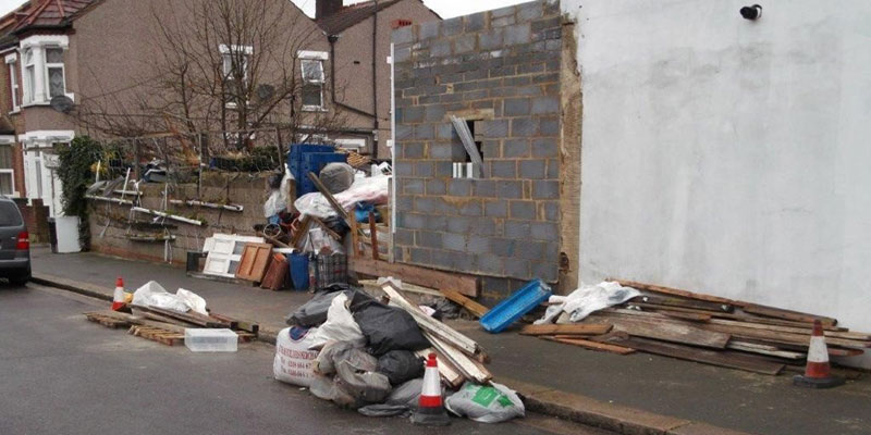 Woman fined for 'horrendous' dumping of rubbish outside her home