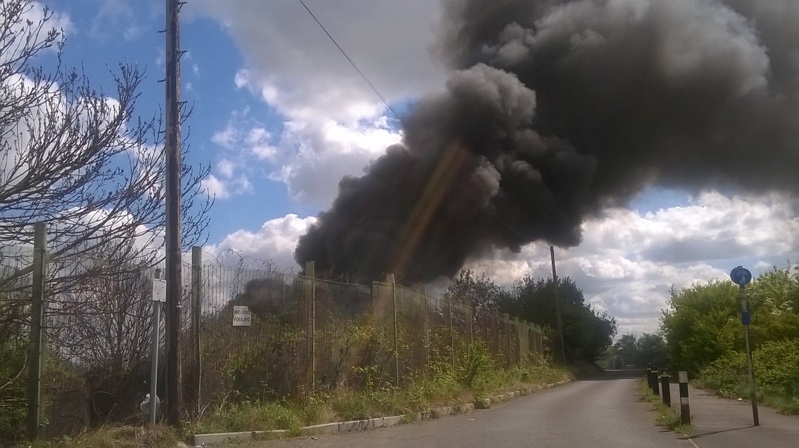 Massive pile of rubbish, derelict boats and gas cylinders on fire in Erith