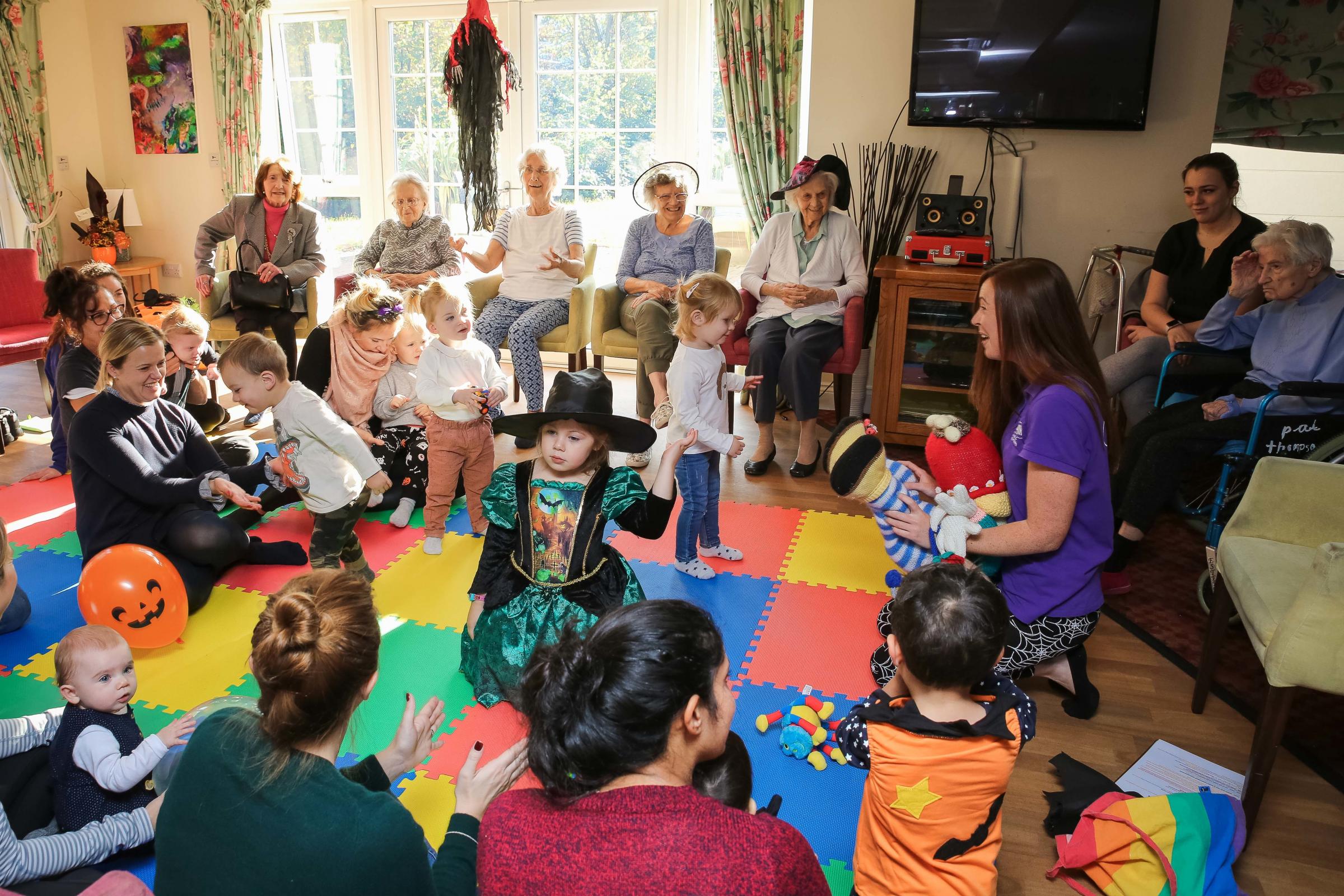 Loughton toddler group's Halloween surprise visit to Woodland Grove care home