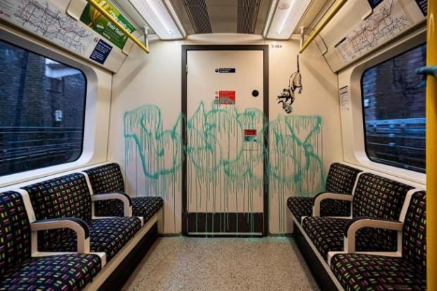 This Is Local London: Banksy sprayed the inside of a London Underground train carriage with messages about the spread of coronavirus earlier this year