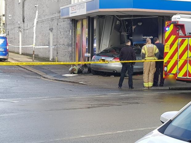 This Is Local London: The Audi was left embedded into a cash machine at Tesco