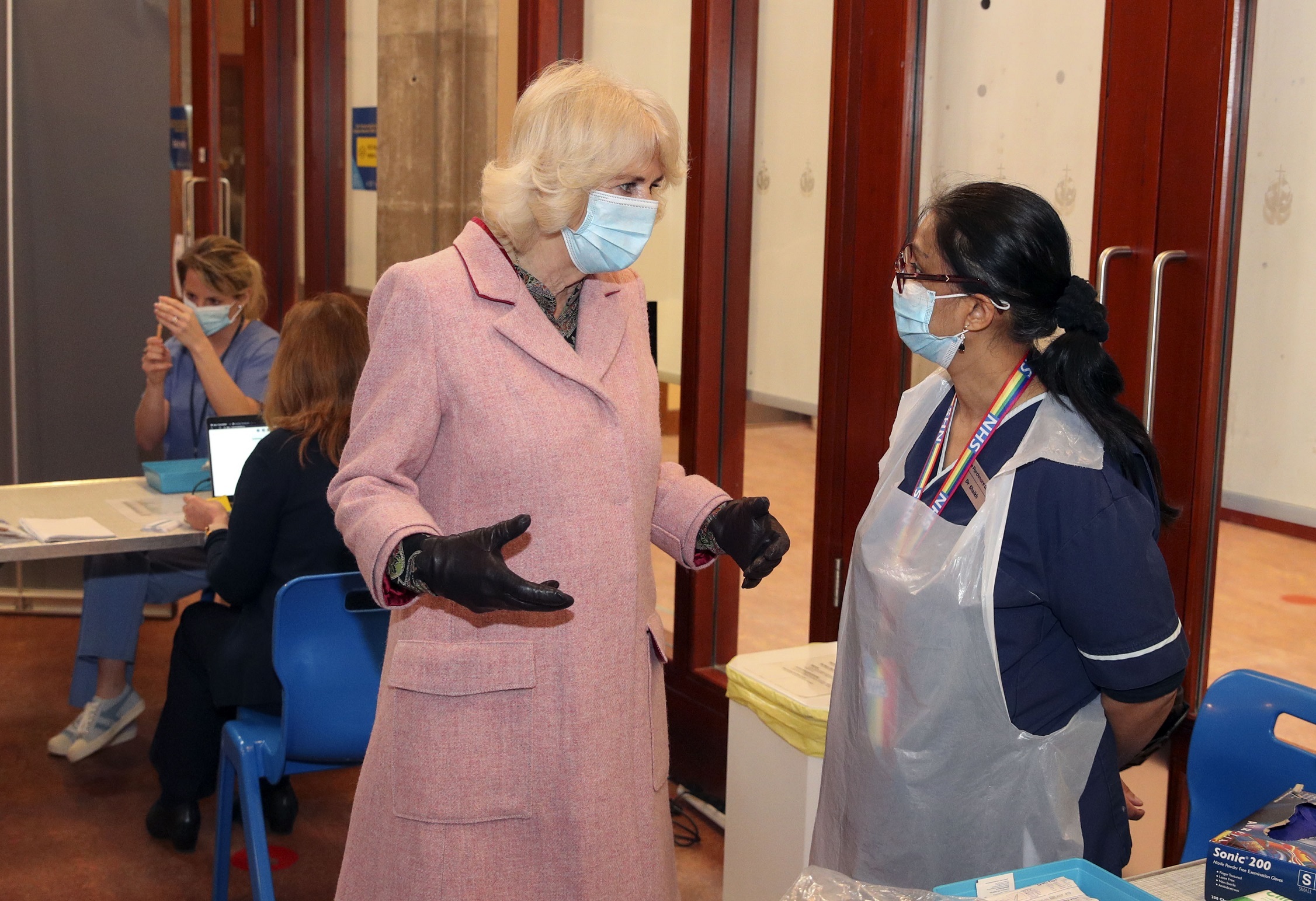 The Duchess of Cornwall talks to Dr Shaikh (right) during a visit to the Community Vaccination Centre at St Pauls Church