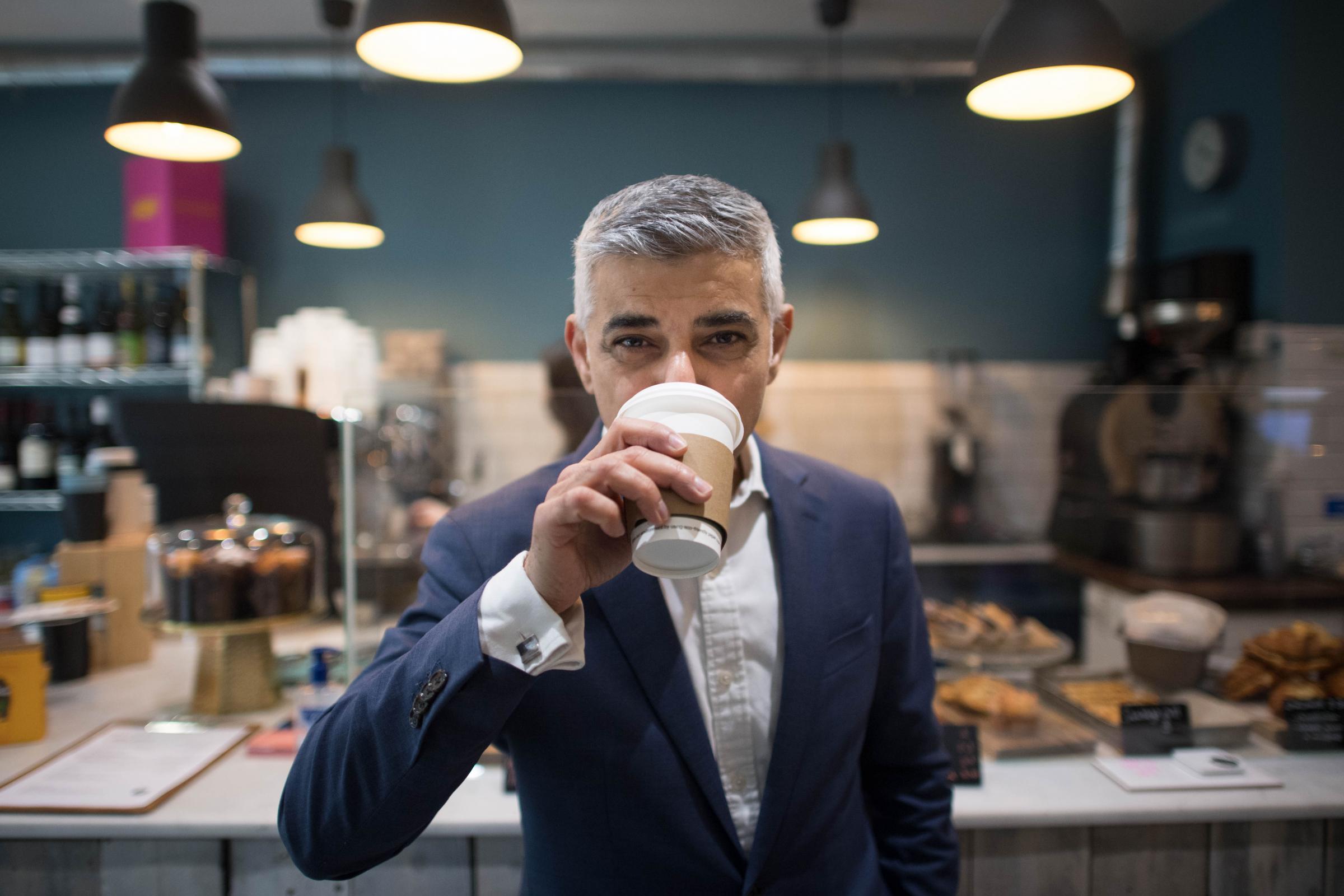 Mayor of London Sadiq Khan drinks a cup of coffee at his campaign launch. Photo: PA