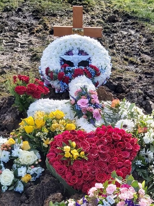 Jimmys grave adorned with tributes