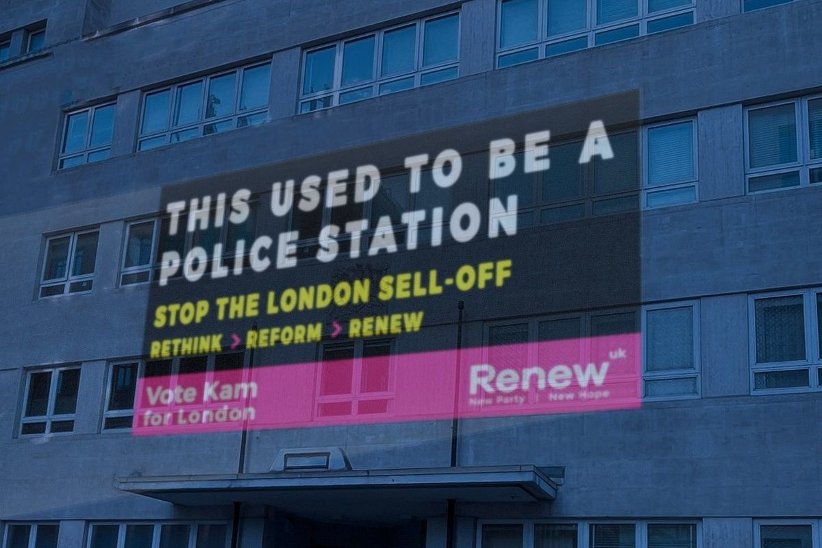 A Renew Party campaign image is projected onto a former police station in Westminster. Credit: Renew Party handout