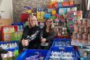 Louise Houghton-Campion and Kasey Cowley with the items bought from donations