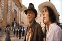 (L-R): Indiana Jones (Harrison Ford) and Helena (Phoebe Waller-Bridge) in Lucasfilm's INDIANA JONES AND THE DIAL OF DESTINY.