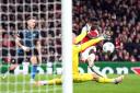 Bukayo Saka scores Arsenal's second goal against Sevilla