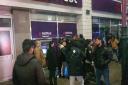 Crowds seen gathering around the East Ham cashpoint
