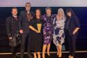Members of Oakland Care receive their award from Investors in People chief executive Paul Devoy - left - and event host Anna Richardson - right