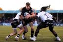 Saracens' Owen Farrell forces his way through the Bristol defence