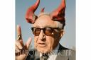 A picture of Henry Kissinger with satan horns