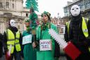 Haringey Tree Protectors dressed as condemned trees and insurers with chainsaws in protest against 'baseless' felling