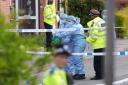 Forensic officers seen at the site of the incident