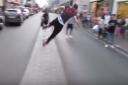 The acrobatic young pedestrian showed off an unusual way of getting across Oxford Street