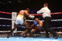 David Haye is pushed away by the referee after knocking out Mark De Mori of Australia during their International heavyweight contest at The O2 Arena