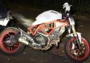 Ducati Monster, with a white body, red chassis and red wheels used in Dalston drive-by shooting