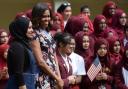 US first lady Michelle Obama meets pupils and staff at the Mulberry School for Girls in Tower Hamlets, east London