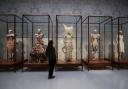 Dresses on display during the Alexander McQueen: Savage Beauty exhibition at the Victoria and Albert Museum in London