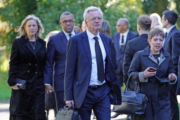 This Is Local London: David Davies (centre) arrives for the funeral of James Brokenshire at St John The Evangelist church in Bexley, south-east London. 