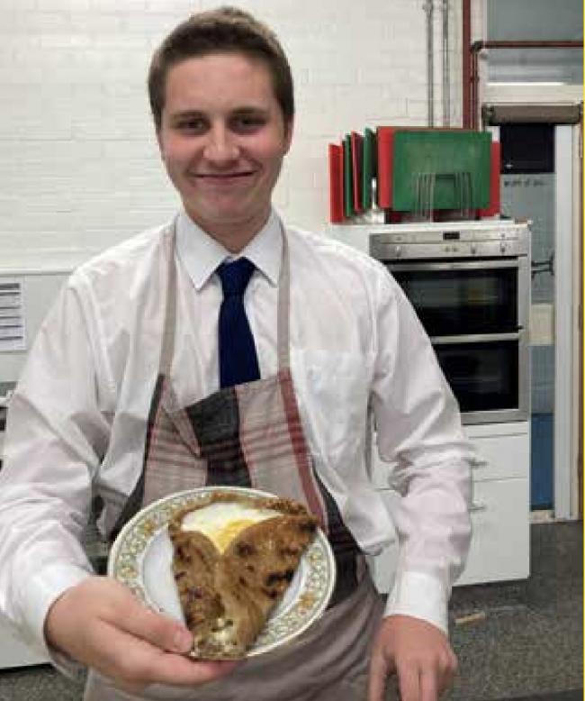 A proud student flaunting his dilapidated galette