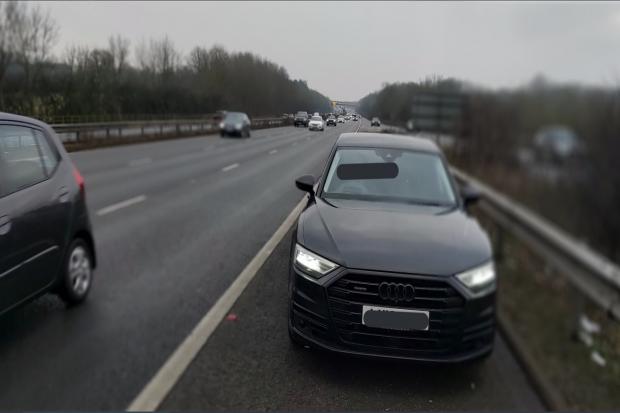 Motorway driver used phone and drove child without safety seat