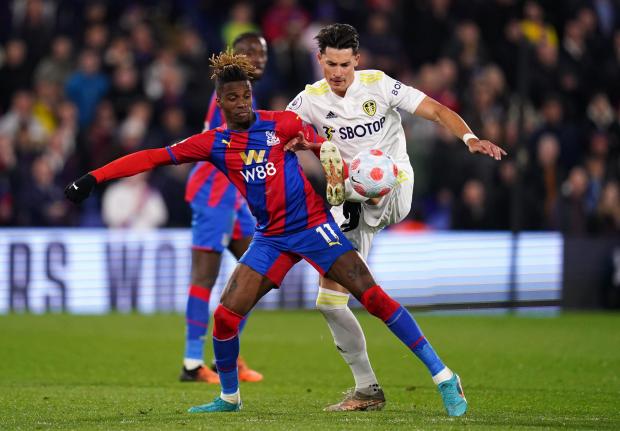 This Is Local London: Crystal Palace attacker Wilfried Zaha challenges for the ball