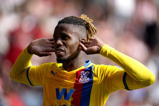 This Is Local London: Crystal Palace's Wilfried Zaha celebrates scoring their side's second goal of the game during the Premier League match at St Mary's Stadium, Southampton