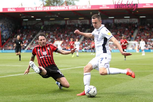 This Is Local London: Bournemouth's Adam Smith (left) and Millwall's Jed Wallace battle for the ball during the Sky Bet Championship match at the Vitality Stadium, Bournemouth