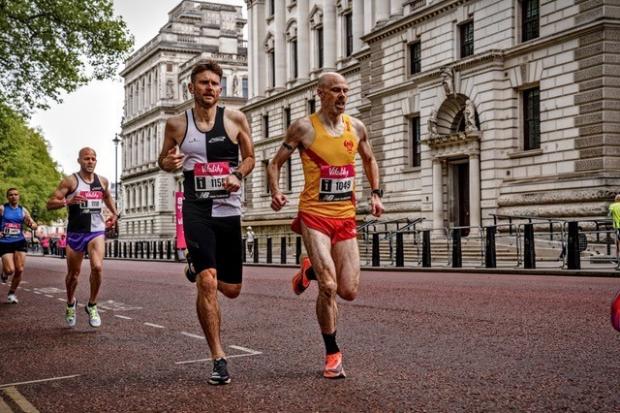 Hercules Wimbledon’s  Richard McDowell, Vitality Westminster Mile, and Tom Jervis with Eilish McColgan in the vitality 10km