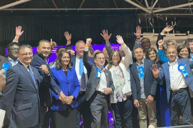 Cllr Paul Osborn (centre) as Conservatives celebrate victory in the 2022 Harrow local elections