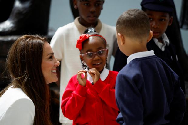 This Is Local London: The Duchess of Cambridge speaks with children at the unveiling of the National Windrush Monument the unveiling of the National Windrush Monument at Waterloo Station, to mark Windrush Day