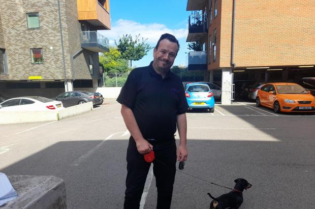 Resident Barry Smith, taking his dog Mash out for a walk, explained his frustrations with the car park issues at Erith Park. CREDIT: Kiro Evans - free to use