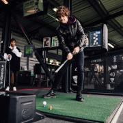 Golfers can practise shots on Topgolf's many outdoor hitting bays, Source: Ready10