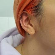 Two helix piercing done by Chloe, a piercer at the shop Seven Sun