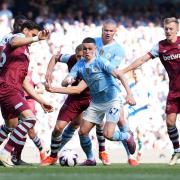 Manchester City'sPhil Foden attacks against West Ham United